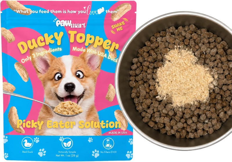 The Pawmart Ducky Topper pouch beside a bowl of kibble with topper.